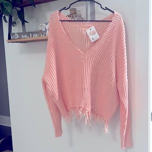 Women’s size L, pink sweater.